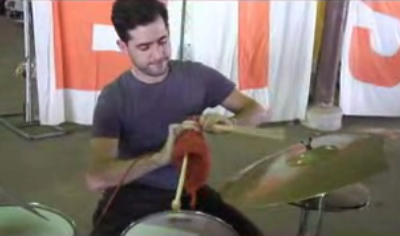 Man Knits While Playing Drums